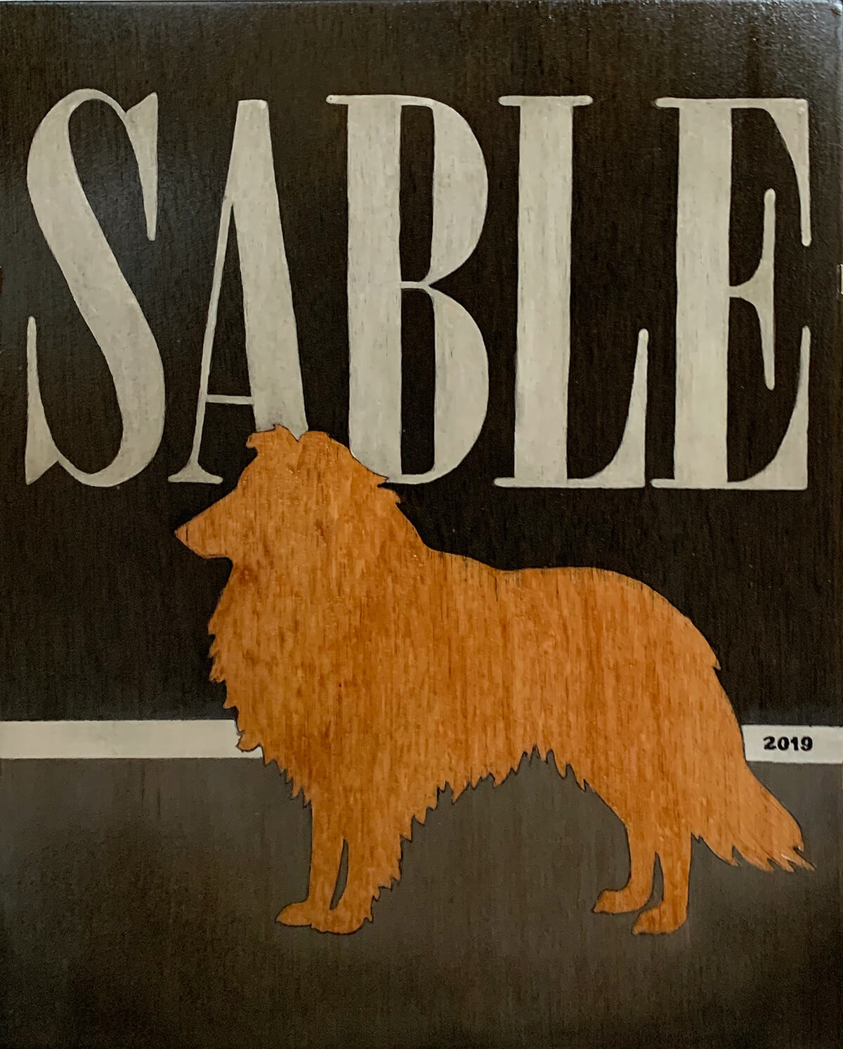 Wood painting of a Sheltie